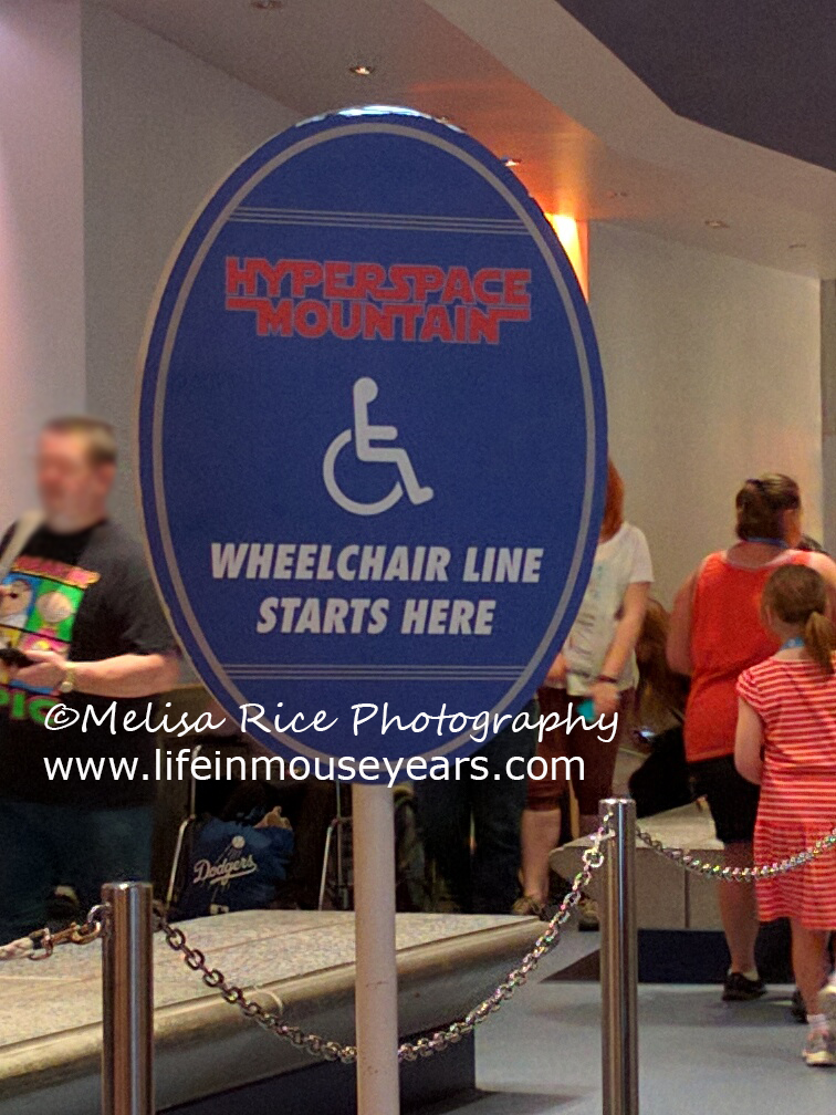 The wheelchair disability sign at the exit of Hyperspace Mountain AKA Space Mountain.